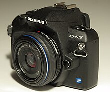 An Olympus E-420 camera, sold with a very thin 25mm "pancake" lens. The E-4XX series was advertised as the smallest true DSLR in the world. Olympus E-420.jpg