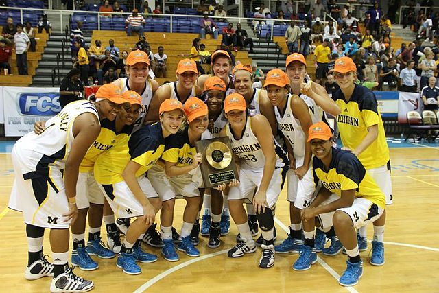 Michigan team with championship trophy at the 2011 Paradise Jam tournament