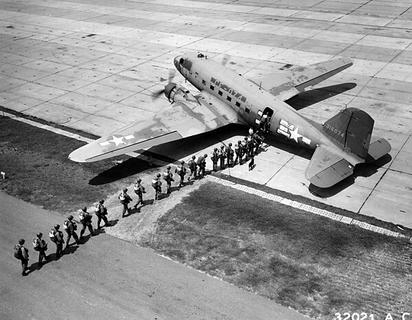 Students board a C-47, from the 75th Troop Carrier Squadron, at Lawson Field (circa August 1946).