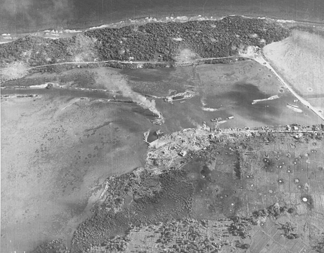 The bombarded former Piti Navy Yard and causeway to Cabras Island on July 20, 1944, two days before the U.S. landings.