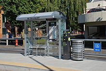 The amenities at each streetcar stop include a small shelter (with interior information display), ticket vending machine and trash can. Portland Streetcar stop, 7th & Halsey, Sep. 2012.jpg