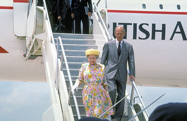 Queen Elizabeth II and Prince Philip disembark from a British Airways Concorde at Bergstrom Air Force Base near Austin, Texas, on their state visit to