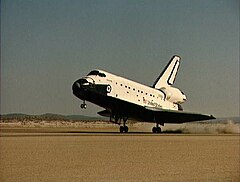 Space Shuttle Atlantis lands on the dry desert lakebed of Edwards Air Force Base at the end of the STS-51-J mission.