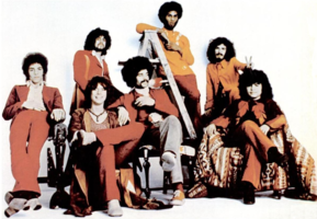 The "classic" line-up in 1971.Left to right: Neal Schon, Gregg Rolie, Michael Shrieve, Michael Carabello, David Brown, Carlos Santana, José "Chepito" Areas