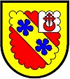 a canton--Gules; on a bend or two cinquefoils azure, on a sinister canton argent a cross crosslet fitchy issuing out of a crescent of the first; a bordure engrailed or for difference--Cook, Scotland Sinister canton cook wiki.jpg