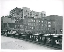 Southwesterly from the railroad bridge on Harrison Avenue Showing frontage on Motte Street with the building at 1000 Washington in the background, June 24, 1952