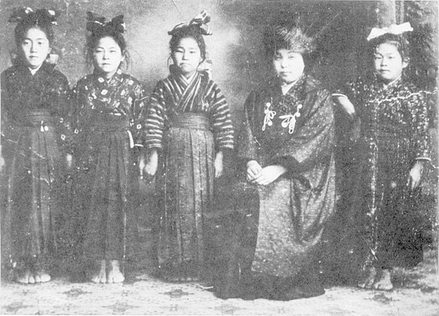 A schoolteacher wearing a hifu with white ties, 1912.