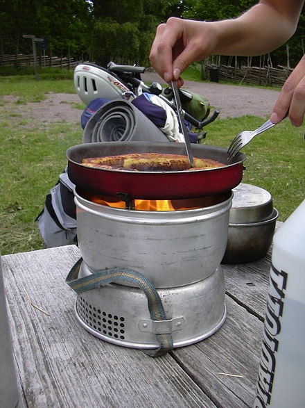 Cooking with a Trangia camping stove, which can use gas or alcohol as fuel.