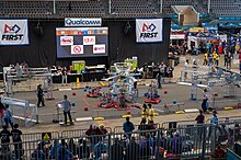 Six robots sit on the field before a match.