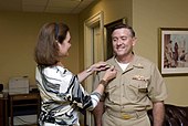 Vice Adm. Bruce E. MacDonald is pinned with his new rank by his wife, Karen, on 4 August 2008. US Navy 080804-N-8273J-062 Vice Adm. Judge Advocate General (JAG) Bruce MacDonald is pinned by his wife, Karen.jpg