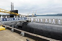 US Navy 100712-N-8119A-029 Sailors assigned to the ballistic-missile Submarine USS Nevada (SSBN 733) take charge of the boat during a crew split and assumption of command ceremony at Naval Base Kitsap-Bangor, Wash.jpg