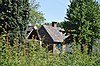 Zomerhuis is gesitueerd aan de linkerzijde van het voorhuis van de boerderij