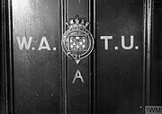 The entrance door to WATU. The crest was a relic from the destroyer HMS Tactician, decommissioned in 1931.