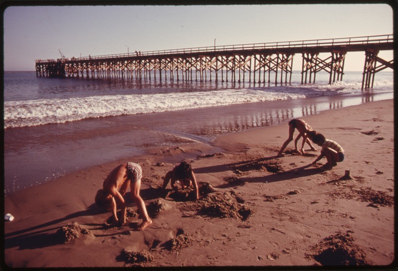 File:YOUNGSTERS PLAY IN THE SAND AT THE GAVIOTA STATE BEACH. IN THE BACKGROUND IS THE PIER. THE AREA IS SCHEDULED FOR... - NARA - 557511.tif