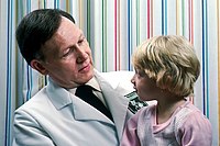 Young girl sits on doctor's lap.jpg