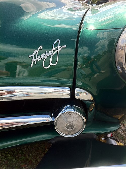 Kaiser's name in script on the front of a 1951 Henry J automobile