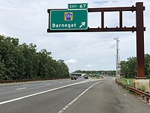 The northbound Garden State Parkway at exit 67 in Barnegat Township 2020-07-11 13 52 09 View north along New Jersey State Route 444 (Garden State Parkway) at Exit 67 (Ocean County Route 554, Barnegat) in Barnegat Township, Ocean County, New Jersey.jpg