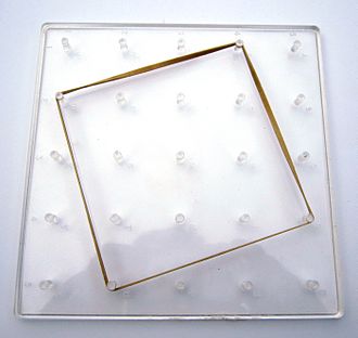 A plastic 5 x 5 geoboard 25 peg geoboard.JPG