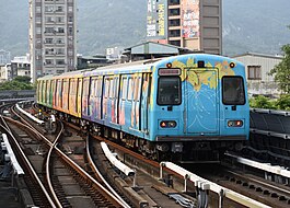 A Taipei Metro C371 train leaving Beitou Station toward Xinbeitou Station (cropped).jpg