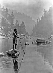 A Hupa fisherman. In the early 20th century, Edward Curtis traveled across America recording photographs of the disappearing lifestyle of American Indian tribes. A smoky day at the Sugar Bowl--Hupa.jpg