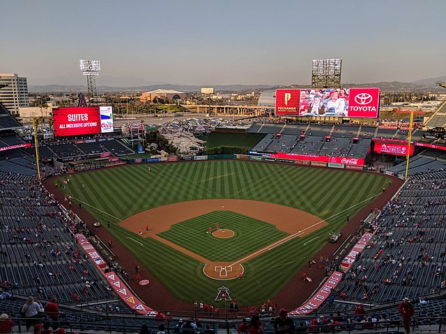 View of a baseball stadium, taken from the upper deck and looking out over the field from center field.