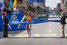 Rita Jeptoo crossing the finishing line Boston-marathon-2013 485618542 o.jpg