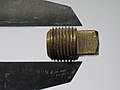 Brass NPT threaded Pipe Plug in a Caliper.jpg