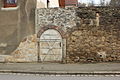 Remains of an enclosure with a low, arched gate