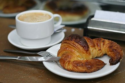 Café with a croissant for breakfast
