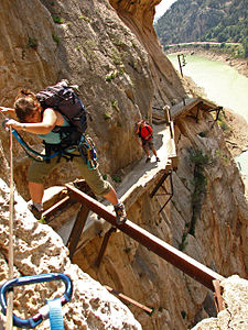 Hikers clip their carabenas onto the wire for safety