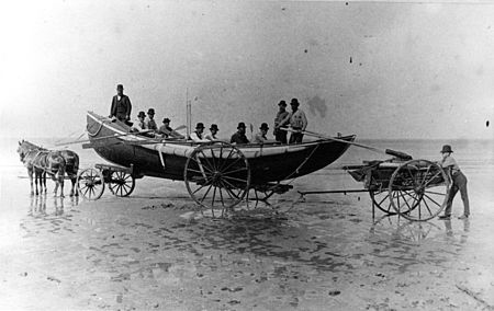 A surboat, like those used to rescue the Ephraim Williams crew, would be towed on a cart like this one, to a suitable launching spot, where she would be pushed into the water deep enough to float her off the cart. Crew members tow a US Lifeboat Service Surfboat mounted a special launching cart -a.jpg