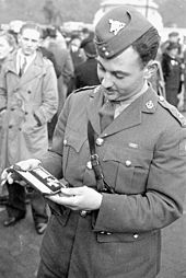 Major Marie-Edmond Paul Garneau, of the Royal 22 Regiment, with the DSO he received for "gallant and distinguished services in the combined attack on Dieppe" after his investiture at Buckingham Palace in October 1942 DSO1.jpg
