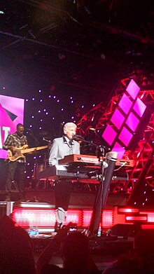 DeYoung performing during the 2014 Eat to the Beat Concert Series, part of the Epcot International Food & Wine Festival, in Walt Disney World Dennis DeYoung (15659121916).jpg