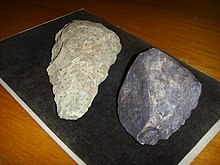 An Oldowan stone tool from Dmanisi (right, replica), compared to a later Acheulean stone tool (left) Dmanisi stone tool 2.jpg