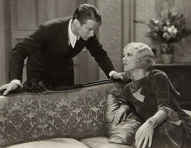 Douglas Fairbanks Jr. and Glenda Farrell as Joe and Olga