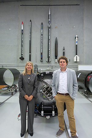 Peter Beck and Dava Newman posing in front of Rocket Lab's sounding rockets Dr Dava Newman, NASA Deputy Administrator visit to New Zealand, July 11-18, 2016 (27619573814).jpg