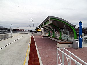 A curved canopy at a bus station