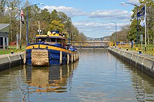 Tugboat in a lock on the Erie Canal Erie Canalway- Tug-Lock.jpg