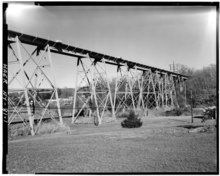 An old photo of the Manhasset Viaduct, looking east towards Manhasset. GENERAL VIEW OF TRAIN TRESTLE - Long Island Railroad, Manhasset Bridge, Manhasset Shore Road Vicinity, Flower Hill, Nassau County, NY HAER NY,30-HEMPN,1-1.tif
