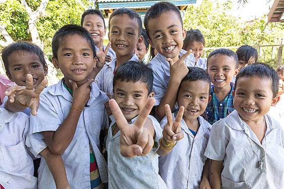 Group photograph of school children smiling in Laos