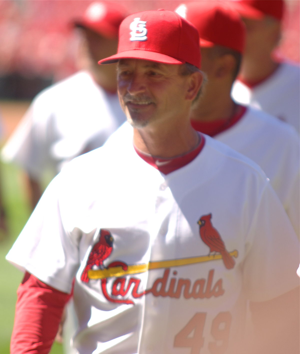 St. Louis Cardinals players and coaches watch batting practice