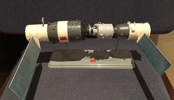 Model of Tiangong space lab with attached Shenzhou crewed spacecraft.