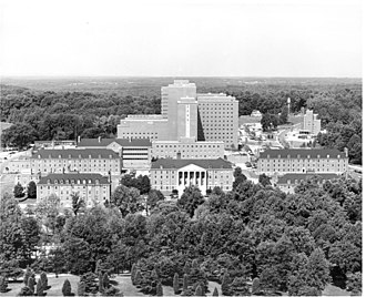 Campus of the National Institutes of Health (NIH) in Bethesda, Maryland around 1963. Although NIH would be largely unaffected by the reorganizations, the National Institute of Mental Health would be transferred to HSMHA in 1968, and then to the new Alcohol, Drug Abuse, and Mental Health Administration in 1973. It would not return to NIH until 1992. NIH campus 1963.jpg