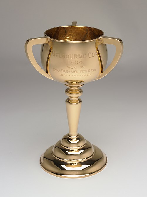 Trophy for the 1934 Melbourne Cup. The trophy is an example of a loving cup-styled trophy, with three handles attached to the bowl.