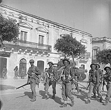 Sicily 1943, British infantry with a Sherman tank to their rear. Pachino, Sicily, 1943.jpg