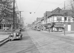 Murray Avenue in Squirrel Hill, looking north near Darlington Road, circa 1937. The electric trolley lines are clearly visible running down the center of the street. Pittsburgh Manor Theater in 1937.png