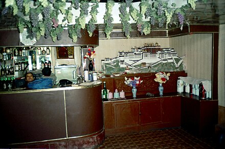 Bar in Lhasa with image of Potala on wall; 1993