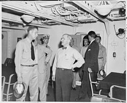 President Harry S. Truman tours Augusta, the ship that will take him to Europe to attend the Potsdam Conference in Germany. He and Commander C. L. Freeman are in the wardroom. (National Archives and Records Administration) President Harry S. Truman tours the U. S. S. Augusta, the ship that will take him to Europe to attend the Potsdam... - NARA - 198681.jpg