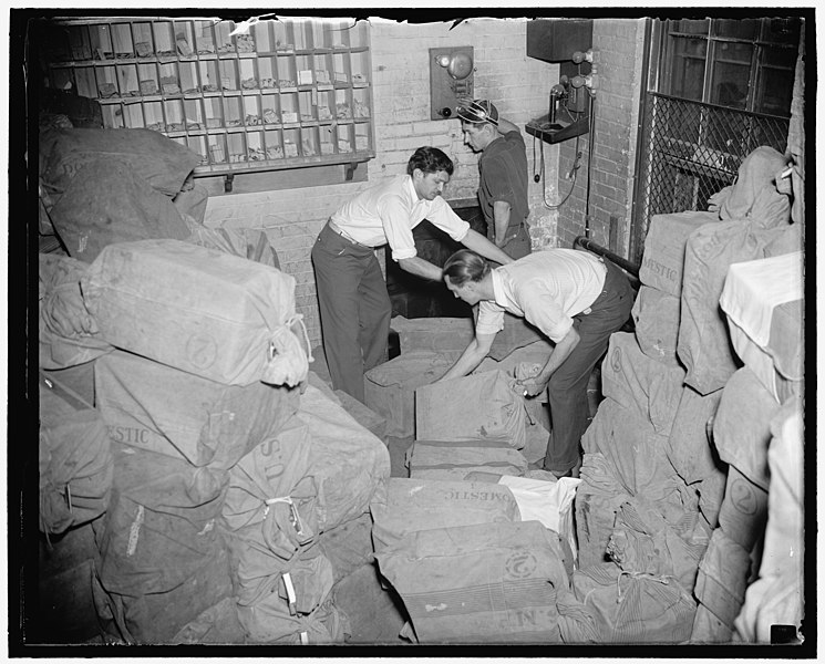 File:Ready for postman. Washington, D.C., Oct. 7. After they are printed and folded for mailing at the Government Printing Office, the unemployment census questionaires are dumped into a mail LCCN2016878021.jpg