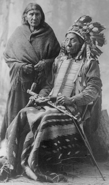 File:Red Cloud & wife. (seated, in regalia, holding pipe) LCCN2016647630 (cropped).jpg